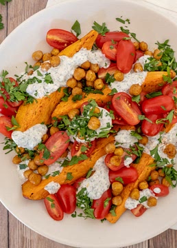 Mediterranean sweet potato and chickpea salad with garlic-tahini dressing